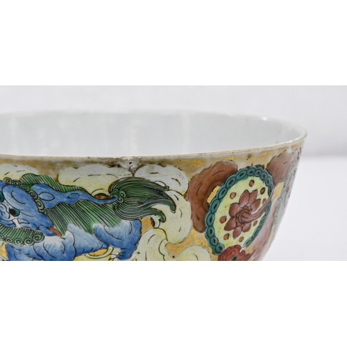 217 - A Chinese porcelain bowl, late 19th c, richly enamelled and gilt with dogs of Fo, a pomegranate to t... 