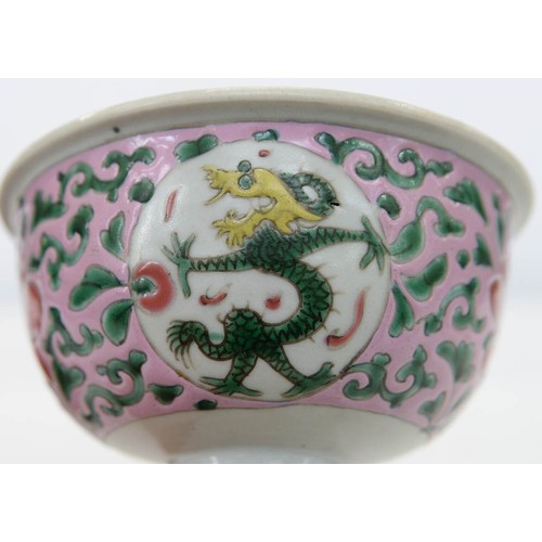 273 - A Chinese famille rose stem cup, the bowl enamelled with dragon roundels and peonies on a pink groun... 