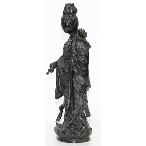 325 - A Chinese bronze figure of Guanyin, 19th c, a lotus and flask in her hands, on lotus base, 32cm h... 