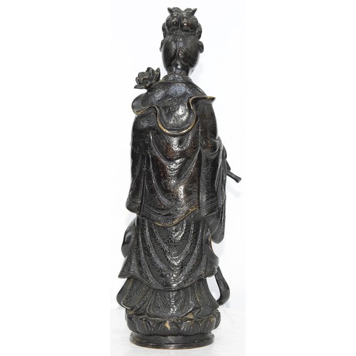 325 - A Chinese bronze figure of Guanyin, 19th c, a lotus and flask in her hands, on lotus base, 32cm h... 