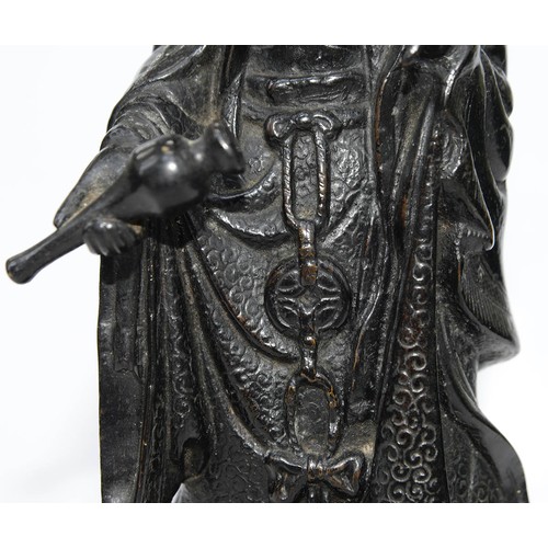 325 - A Chinese bronze figure of Guanyin, 19th c, a lotus and flask in her hands, on lotus base, 32cm h... 