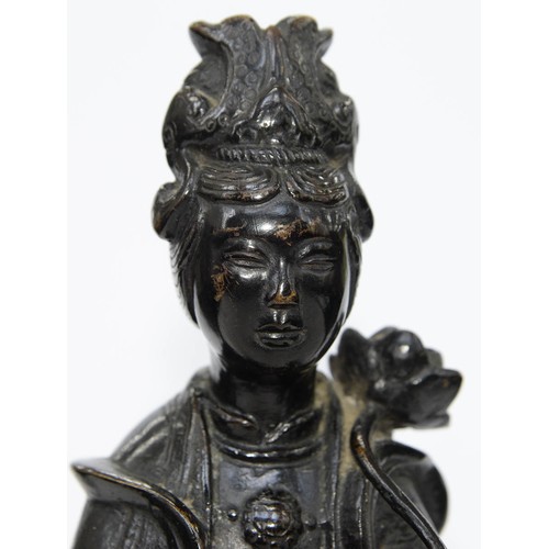 325 - A Chinese bronze figure of Guanyin, 19th c, a lotus and flask in her hands, on lotus base, 32cm h... 