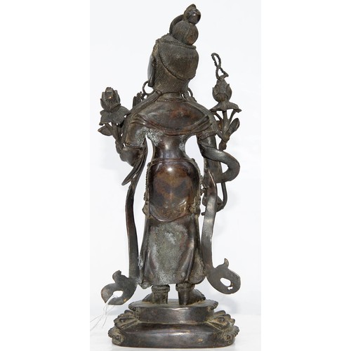 327 - A Tibetan bronze figure of Guanyin, 19th c, on lotus base, sealed, 26.5cm h