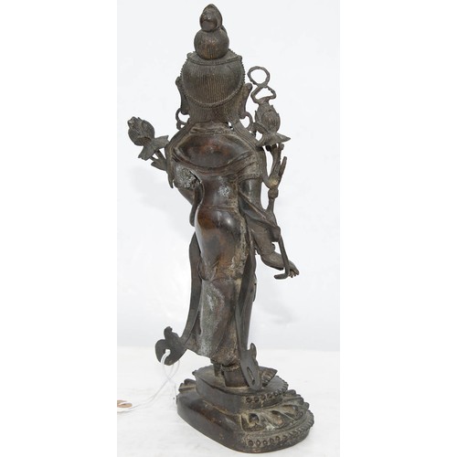 327 - A Tibetan bronze figure of Guanyin, 19th c, on lotus base, sealed, 26.5cm h