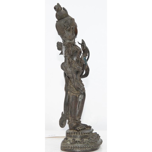 327 - A Tibetan bronze figure of Guanyin, 19th c, on lotus base, sealed, 26.5cm h