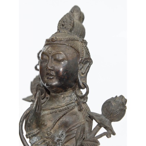 327 - A Tibetan bronze figure of Guanyin, 19th c, on lotus base, sealed, 26.5cm h