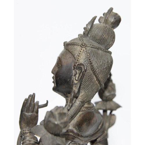 327 - A Tibetan bronze figure of Guanyin, 19th c, on lotus base, sealed, 26.5cm h