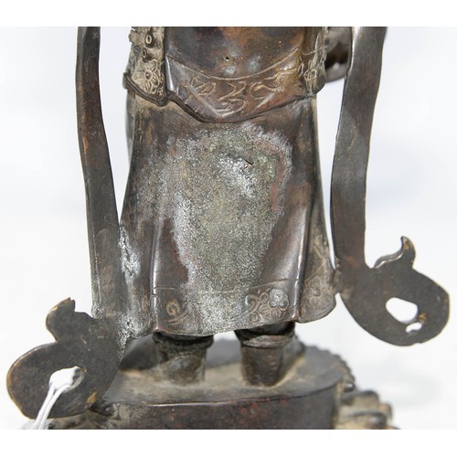 327 - A Tibetan bronze figure of Guanyin, 19th c, on lotus base, sealed, 26.5cm h