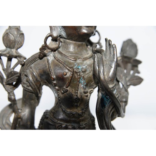 327 - A Tibetan bronze figure of Guanyin, 19th c, on lotus base, sealed, 26.5cm h