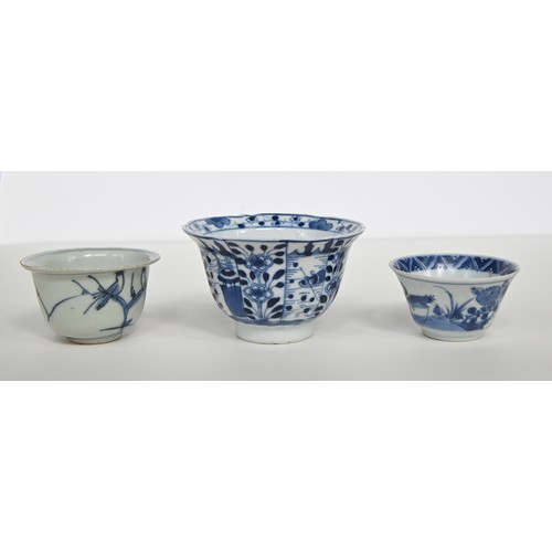 115 - A Chinese blue and white tea bowl and pair of saucers, Kangxi period, saucers 12.7cm diam, conch she... 