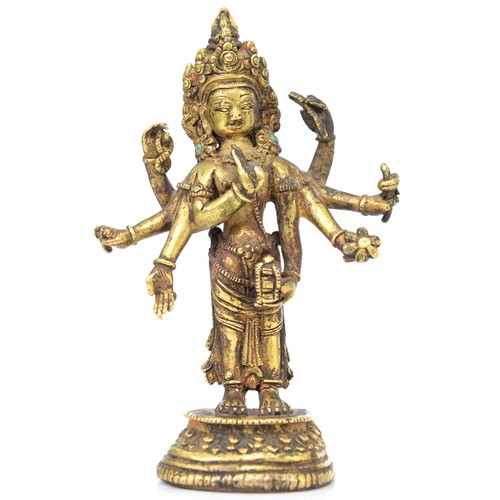 330 - A Tibetan miniature gilt bronze figure of  Vasudhara (Tara), 19th c, sealed, 10cm h