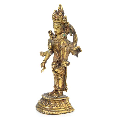 330 - A Tibetan miniature gilt bronze figure of  Vasudhara (Tara), 19th c, sealed, 10cm h