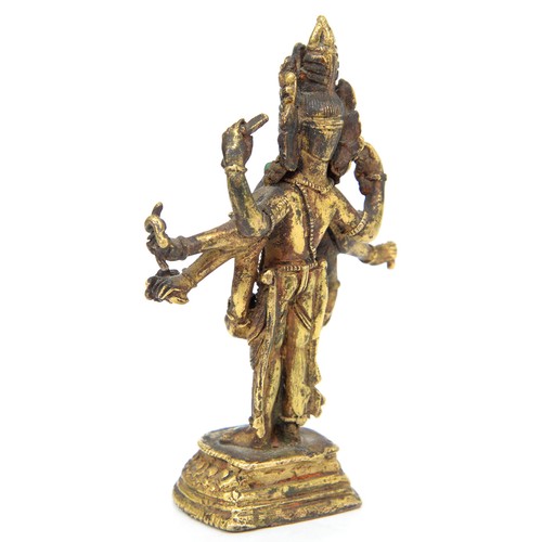 330 - A Tibetan miniature gilt bronze figure of  Vasudhara (Tara), 19th c, sealed, 10cm h