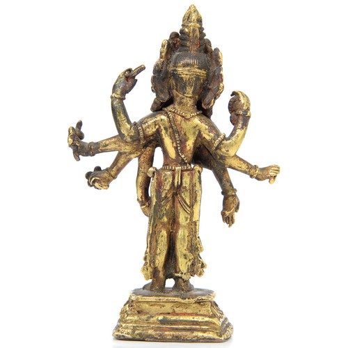 330 - A Tibetan miniature gilt bronze figure of  Vasudhara (Tara), 19th c, sealed, 10cm h