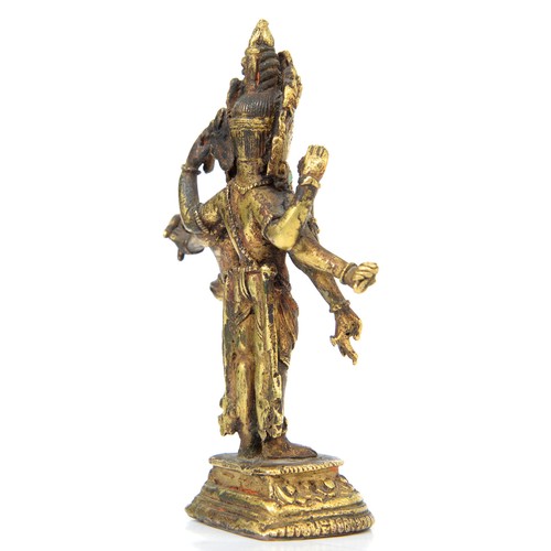 330 - A Tibetan miniature gilt bronze figure of  Vasudhara (Tara), 19th c, sealed, 10cm h