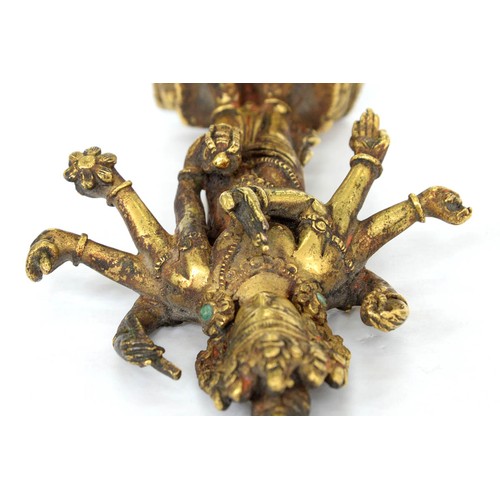 330 - A Tibetan miniature gilt bronze figure of  Vasudhara (Tara), 19th c, sealed, 10cm h