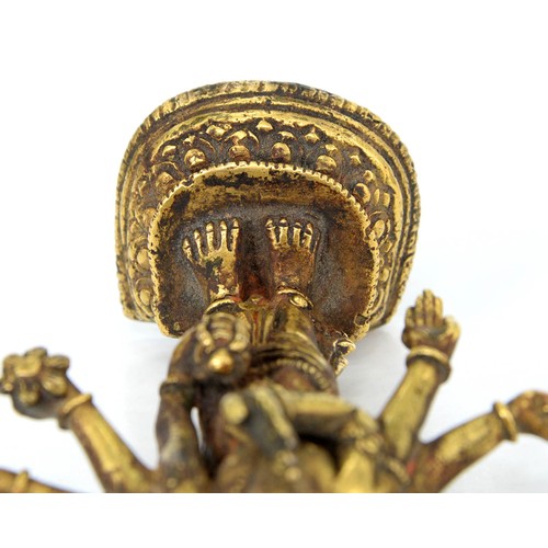 330 - A Tibetan miniature gilt bronze figure of  Vasudhara (Tara), 19th c, sealed, 10cm h