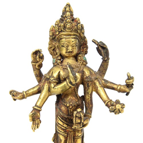 330 - A Tibetan miniature gilt bronze figure of  Vasudhara (Tara), 19th c, sealed, 10cm h