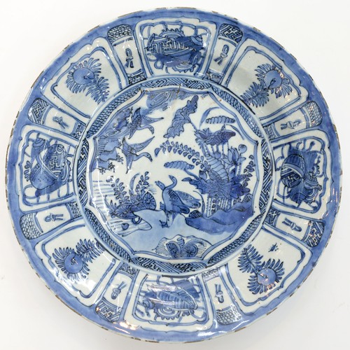 260 - A Chinese Kraak porcelain blue and white dish, c1630-1650, painted to the centre with two geese at t... 