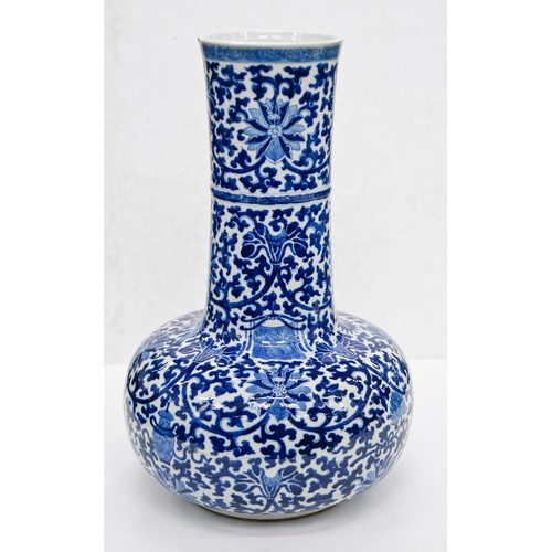 159 - A Chinese blue and white bottle shaped vase, 20th c, painted in Ming style with lotus meander, 40cm ... 