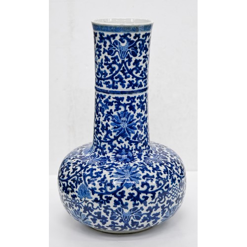 159 - A Chinese blue and white bottle shaped vase, 20th c, painted in Ming style with lotus meander, 40cm ... 