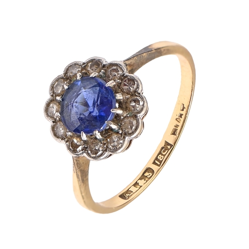 1 - A sapphire and diamond ring, early 20th c, with old cut diamonds, millegrain set, gold hoop marked 1... 