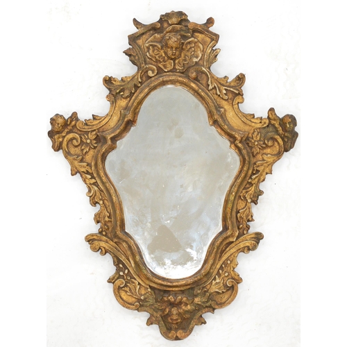 1136 - An Italian Baroque design gilt softwood and gesso mirror, 18th/19th c, shaped cresting and scroll si... 