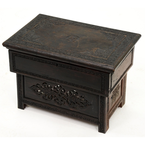 1204 - An Anglo Indian carved and ebonised wood box, late 19th c,  intricately carved lid centred by the in... 