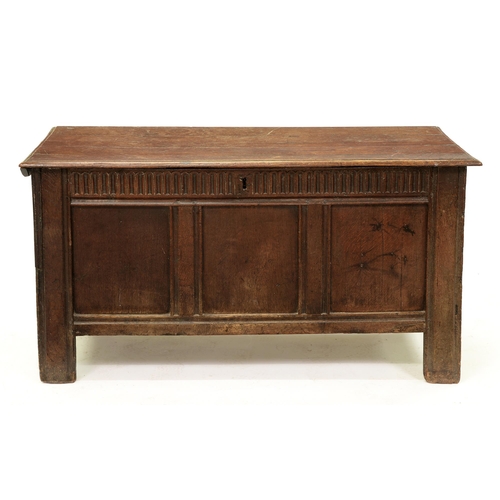 1207 - A Charles II oak chest, with nulled frieze and three panel front, on channel stiles, the interior or... 