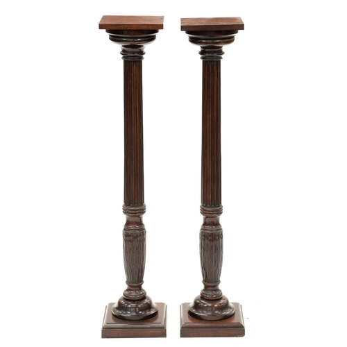 1226 - A pair mahogany torchieres, adapted from bedposts, 125cm h