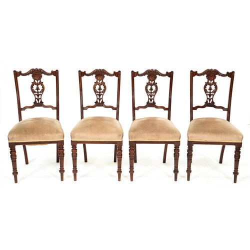 1254 - A set of four Edwardian carved walnut dining chairs