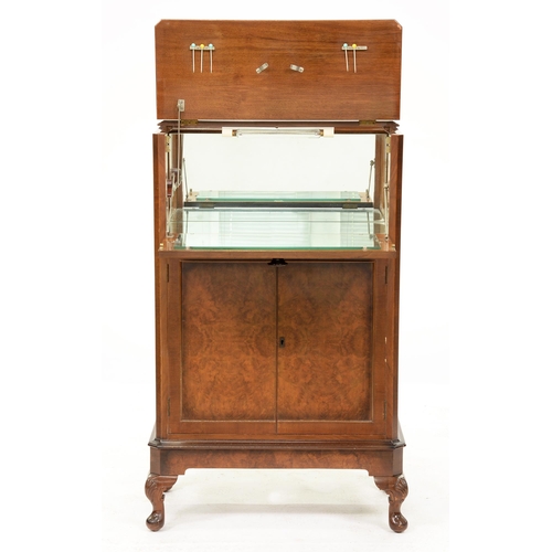 1266 - A walnut cocktail cabinet, c1940,  in matched quarter veneers, 117cm h; 38 x 73cm