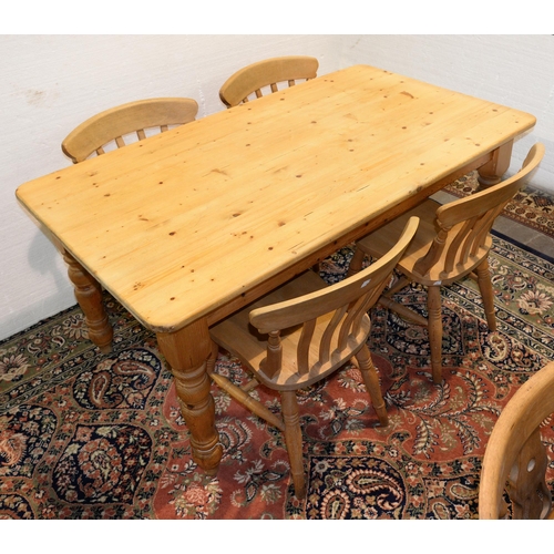 1318 - A waxed pine kitchen table, fitted with a drawer on turned legs, 77cm h; 152 x 86cm and a set of fou... 