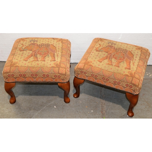 1321 - A pair of footstools, the needlework tops decorated with pictures of processional elephants, 35cm h,... 