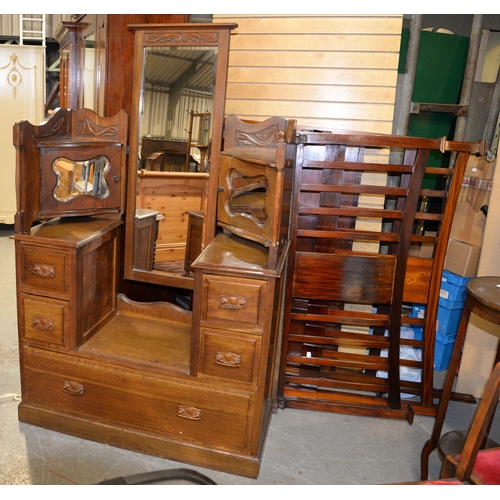 1338 - A Victorian style carved and panelled mahogany wardrobe, with dentil cornice and oval bevelled plate... 