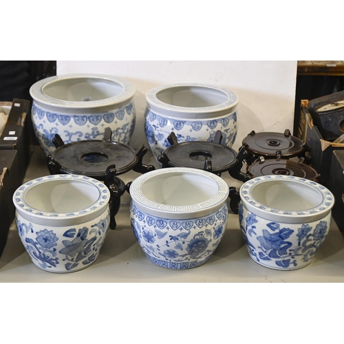 1392 - A graduated set of three Chinese blue and white earthenware jardinieres, and another pair, similar, ... 