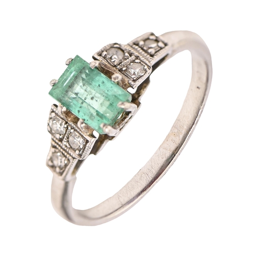 195 - An emerald and diamond ring, the step cut emerald between millegrain set diamond shoulders, in plati... 