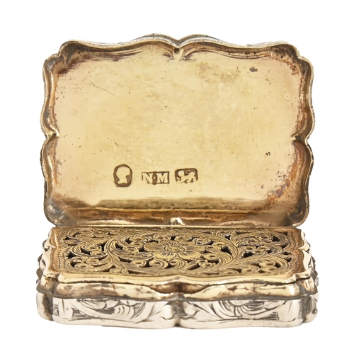 237 - A Victorian silver vinaigrette, of serpentine form and foliate engraved, conforming gilt front-openi... 