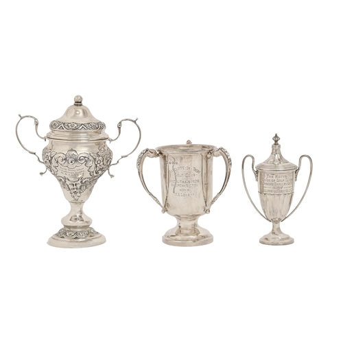 323 - A George V pear shaped silver trophy cup and cover, chased with grotesques and foliage, 16cm h, by A... 