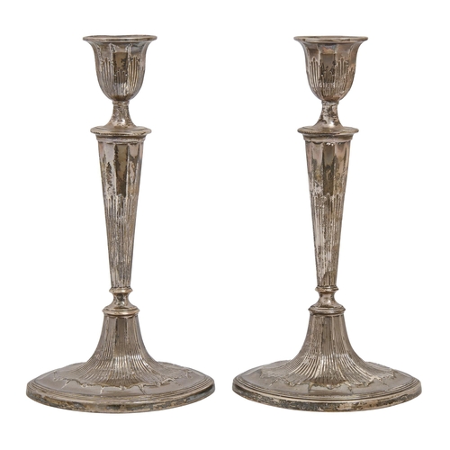 328 - A pair of George III neo classical silver candlesticks, of fluted form, 28.5cm h, by Luke Proctor &a... 