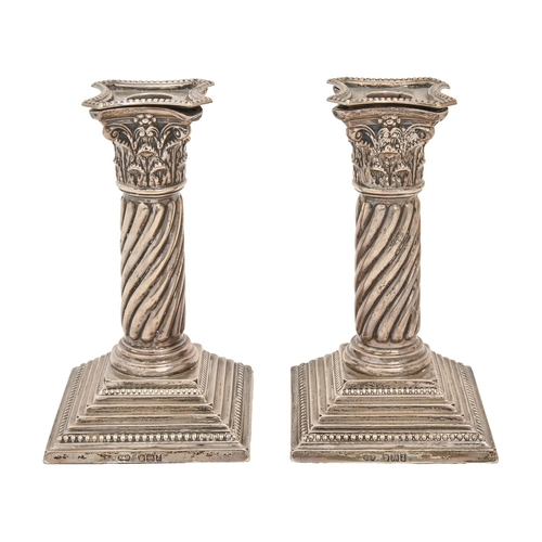 339 - A pair of Victorian silver dwarf candlesticks, with Corinthian capital and spirally reeded shaft, on... 