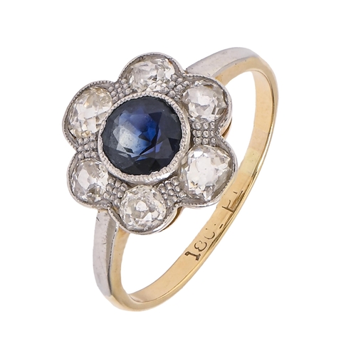 34 - A sapphire and diamond ring, millegrain set in gold marked 18ct, 3.2g, size M