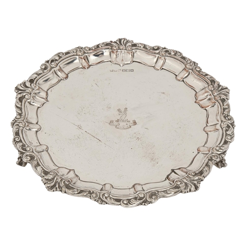 347 - A George V silver salver, on three claw and ball feet, crested, 25.5cm diam, by John Henry Potter, S... 