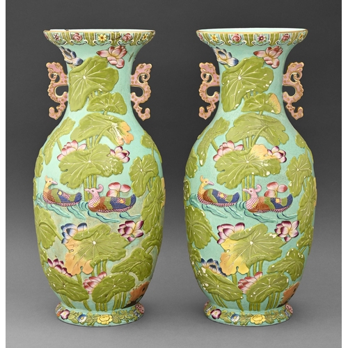 380 - A pair of Staffordshire turquoise ground relief-moulded earthenware vases, c.1870 in the manner of C... 