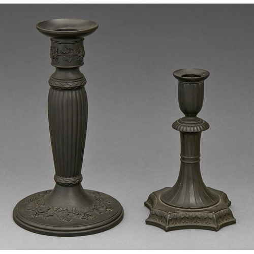 404 - A Wedgwood black basalt candlestick, 19th c, in neo classical style and engine turned, 16cm h, impre... 