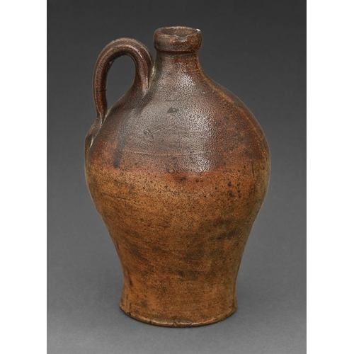 405 - A German saltglazed brown stoneware bottle or jug, Rhineland, second-half 17th c, glazed in merging ... 