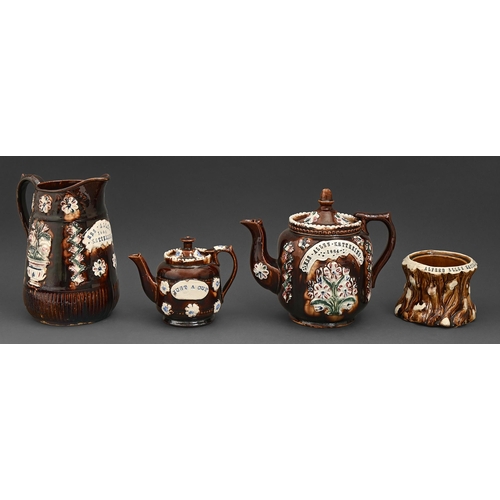 416 - Two Bargeware teapots and covers, a jug and rustic tobacco jar, 1884 and circa, three impressed in p... 