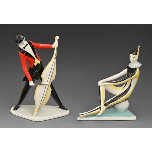 418 - A pair of Zsolnay mid century modern porcelain figures of a musician and clown, designed by Janos To... 