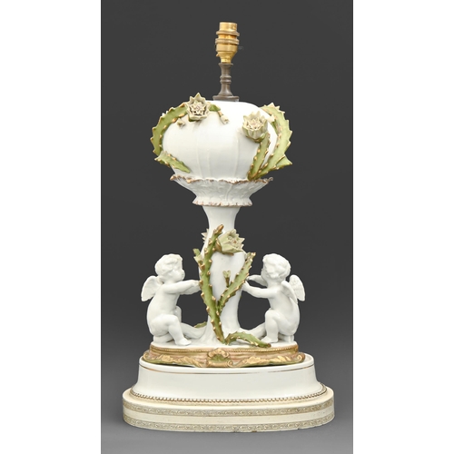 433 - A Moore Brothers putto figural cactus decorated oil lamp late 19th c, converted to electricity and m... 