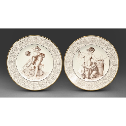 435 - A pair of Continental porcelain plates, outside-decorated, 1885 and 1886, painted in brown monochrom... 